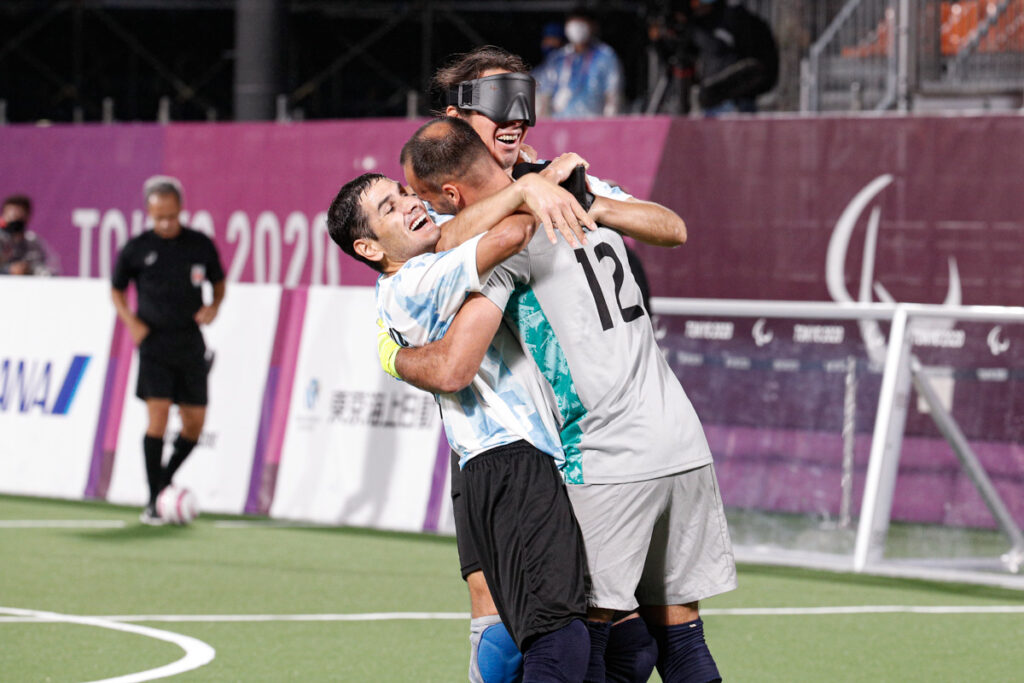 Players from Argentina celebrate their place in the final at Tokyo 2020 by hugging