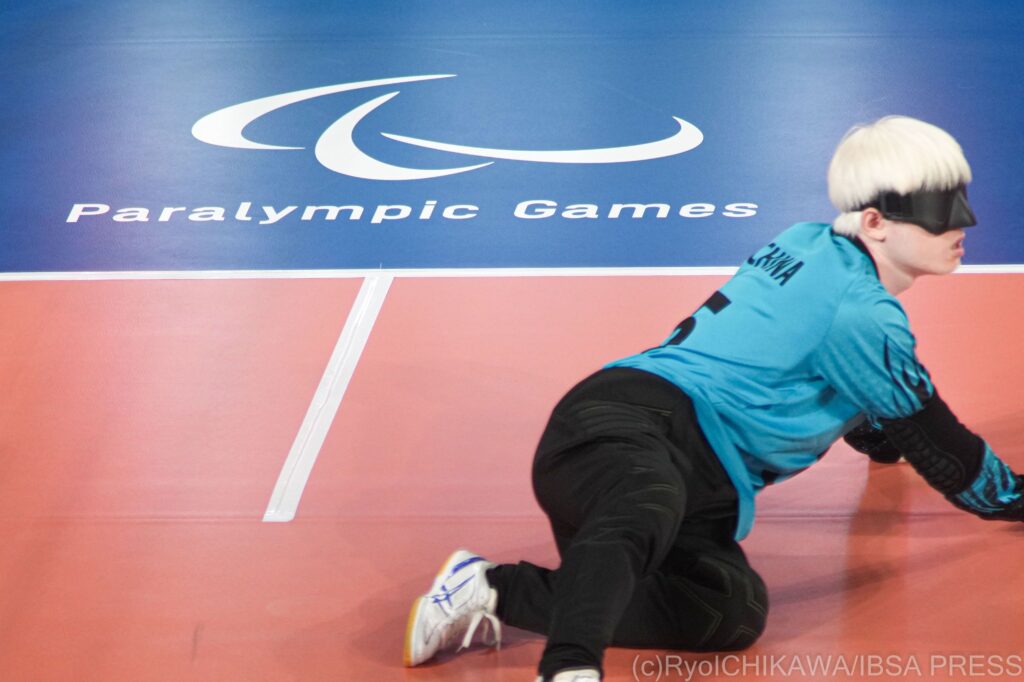 Hu Mingyao of China stretches out on court ready to block a shot